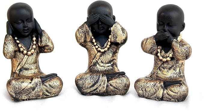 Set of 3 black and gold monk statues depicting See No Evil, Hear No Evil, Speak No Evil poses on a white background.