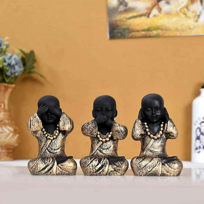 Set of 3 black gold monk statues embodying See No Evil, Hear No Evil, Speak No Evil for Zen home decor.