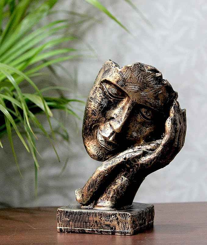 Bit Nite artistic tabletop face sculpture with a bronze finish, showing a contemplative face resting on a hand.