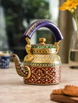 Handcrafted Rajasthani tea kettle with intricate traditional patterns and colorful detailed design