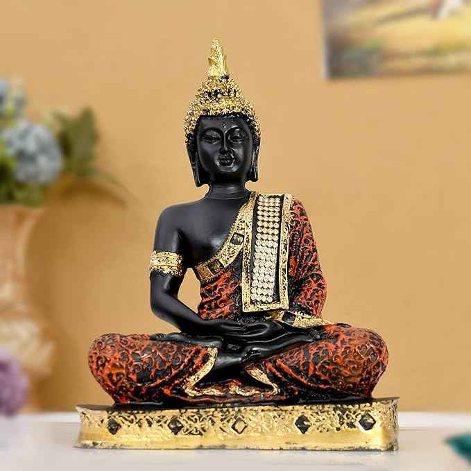 Serenity Buddha statue for living room, black and gold with intricate orange and black robe, meditating idol